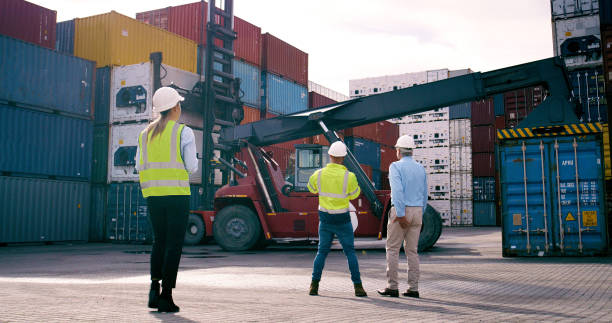 istock Collaboration, container and supervisor talking to staff at commercial dock for supply chain logistics. Conversation, inspection and shipping with team of people at harbor for export or import 2167775967