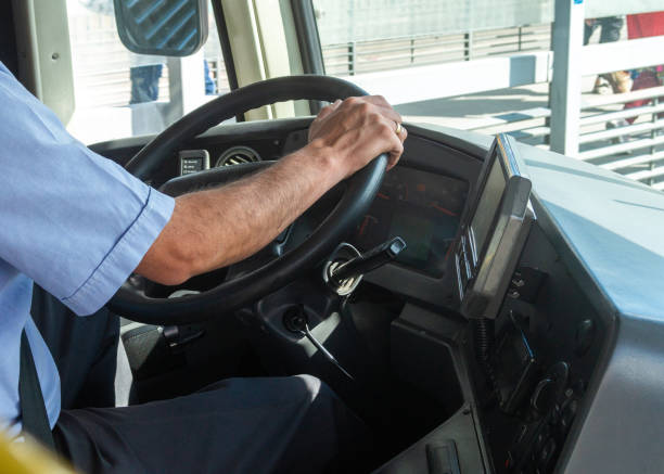 istock A man is driving a bus and is wearing a blue shirt 2167776559
