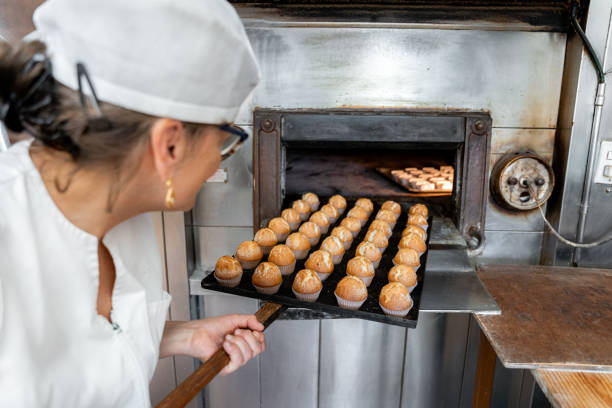 istock Baker checking the pastries in the oven 2167776770