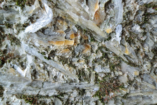 istock A close-up of a rock formation with moss growing between crystalline structures 2167777346