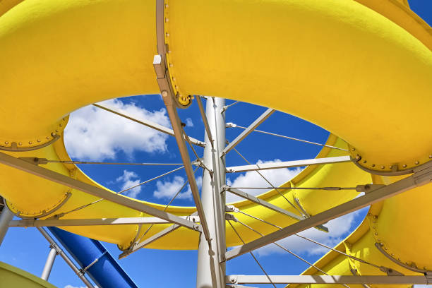 istock Yellow slide in a water park against the sky. 2167777438