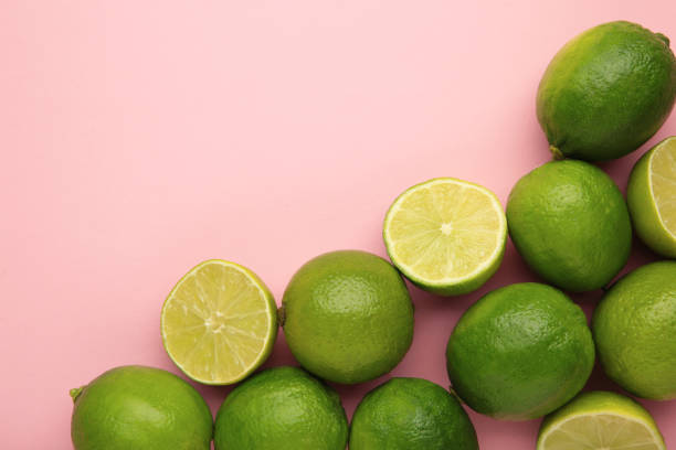istock Green lime with cut in half on pink background. 2167778716