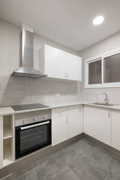 istock Modern kitchen interior with stainless steel appliances and white cabinets 2167779388