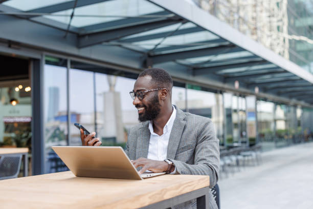 istock Businessman using technology in an outdoor cafe 2167779432
