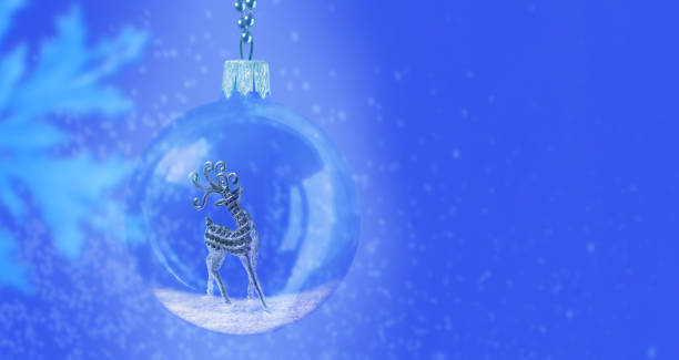 Christmas card with a ball and a deer on a blue background with a snowflake and reflections.