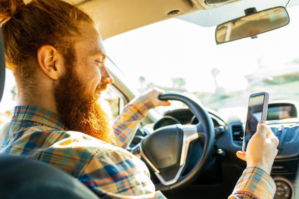 istock handsome redhaired ginger man with long beard going on trip during summer vacation on new car 2167780326