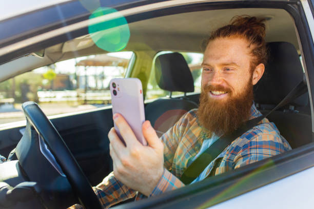 istock handsome redhaired ginger man with long beard going on trip during summer vacation on new car 2167780331