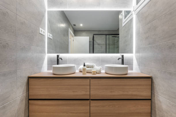 Modern bathroom with illuminated mirror and double vanity for a chic and contemporary look