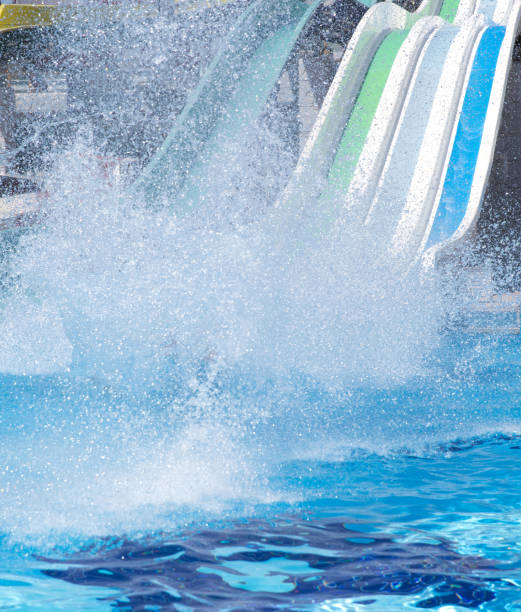 Colorful waterpark tubes and a swimming pool. Outdoor shot