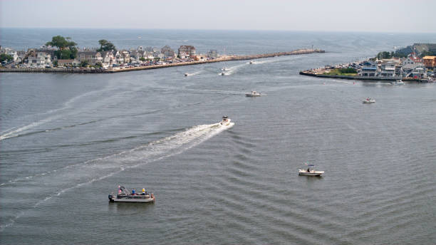 Pleasure craft along with vacationers enjoying summer time at the New Jersey Shore.