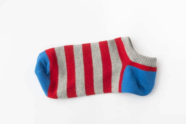 istock Colorful Striped Sock in Red, Gray, and Blue on White Background, Top View 2167782013