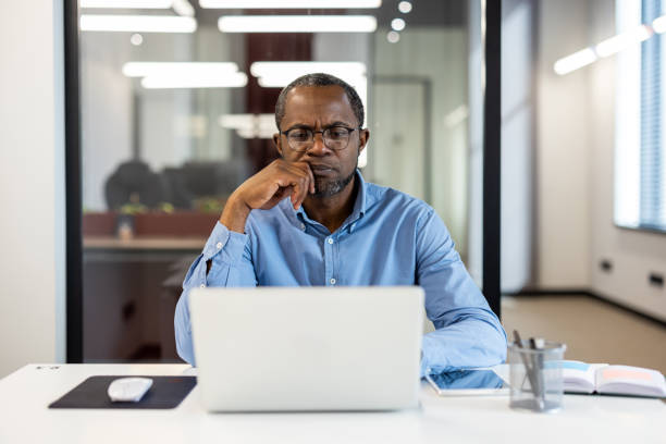istock Focused businessman working on laptop in modern office 2167782730