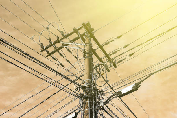 concrete pole with electrical power, telephony and fiber optic cabling - electricity concept