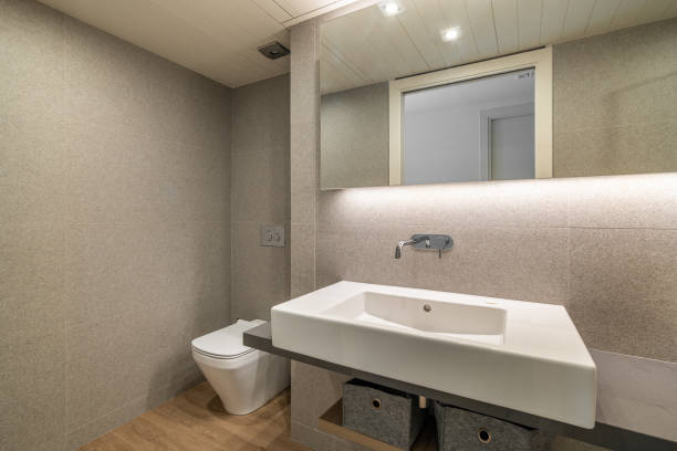 istock Hanging ceramic sink with tap and large mirror in bathroom 2167784481