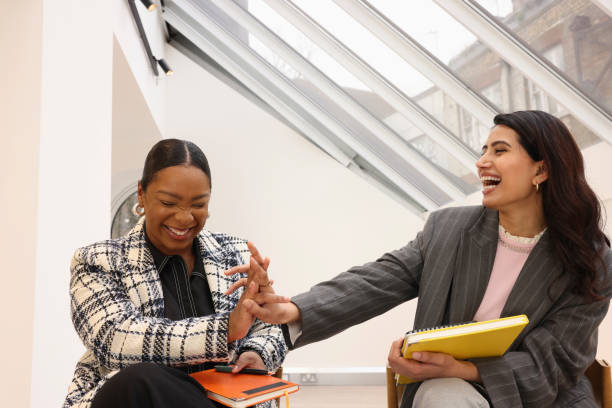 istock Businesswomen laughing in office 2167787766