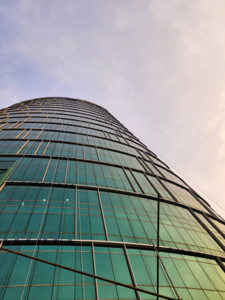 Green glass windows skyscraper. Office building. Modern architectural detail