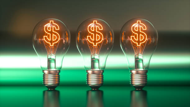 istock Glowing Dollar Sign Light Bulbs Representing Wealth and Prosperity. 3D Render. 2167789109