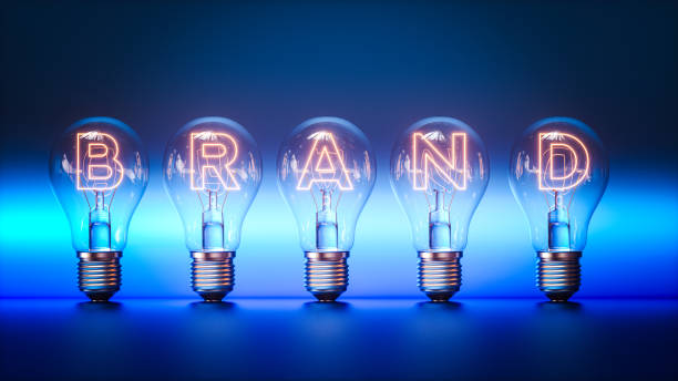 Illuminated Brand Concept. Glowing Light Bulbs with Letters Spelling 
