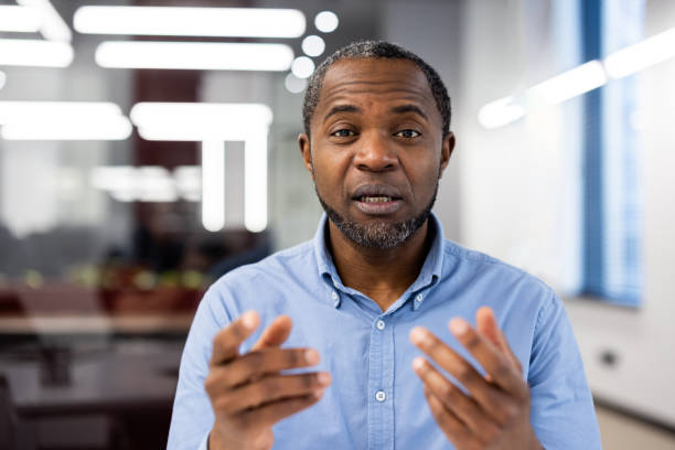 istock Serious business professional speaking in modern office environment with a focus on communication and leadership conveying confidence and expertise 2167792418