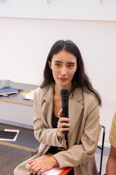 istock Woman talks to microphone 2167793783