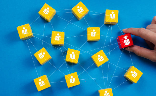 istock Customer relationship management concept, CRM tech. Hand select red block of leadership link on yellow human icon target, customer service focus group, blue background. Hr recruit new employee web 2167797721