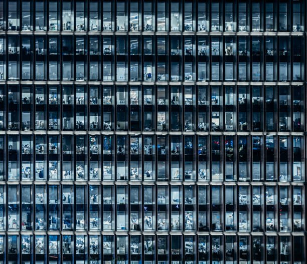 istock Crowded Business People Working in Office Building at Night 2167798531