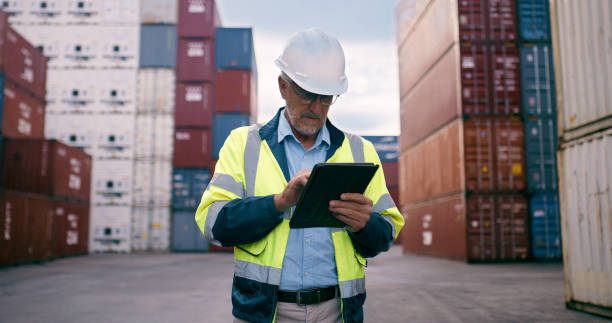 istock Logistics, mature businessman and tablet in cargo dock, quality control or stock management as foreman. Engineer, tech and maintenance for freight, supply chain or industry in global shipping company 2167799310