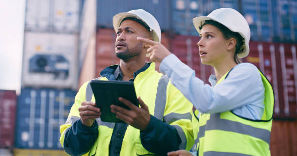 istock Planning, people or tablet for container inspection at an industrial cargo, shipping or freight supply chain. Delivery check, teamwork and logistics workers talking in outdoor distribution trade port 2167799332