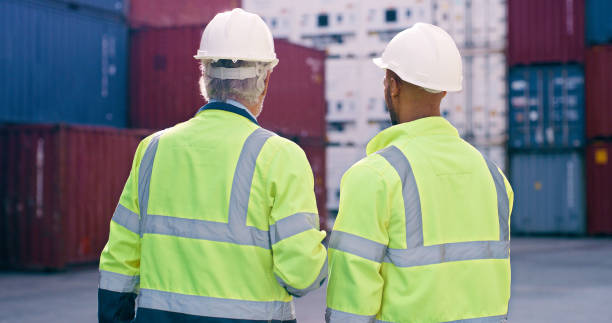 istock Back, people or teamwork for container inspection at industrial cargo, shipping or freight supply chain. Delivery check, manager and logistics workers in outdoor distribution trade port for transport 2167799372