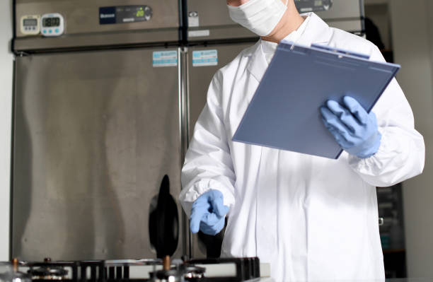 istock Asian man wearing sanitary clothes inspecting kitchen equipment 2167801196
