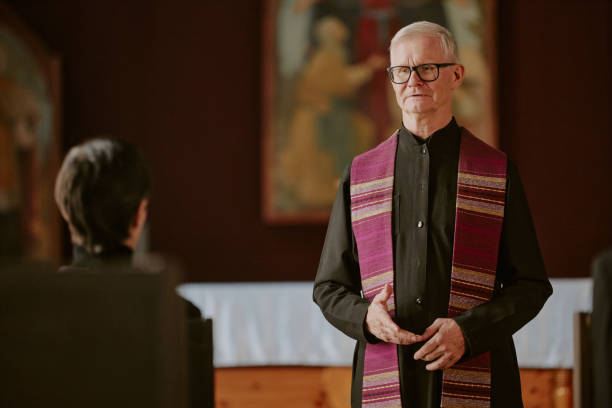 istock Old Pastor During Burial Service 2167801892