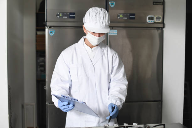istock Asian man wearing sanitary clothes inspecting kitchen equipment 2167802194