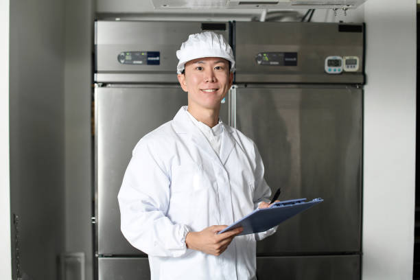 istock Asian man wearing sanitary clothes inspecting kitchen equipment 2167804820