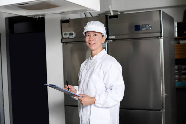 istock Asian man wearing sanitary clothes inspecting kitchen equipment 2167804823
