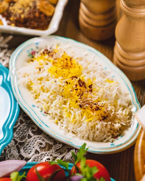 istock Saffron rice being served on floral plate on a rustic table setting 2167805988