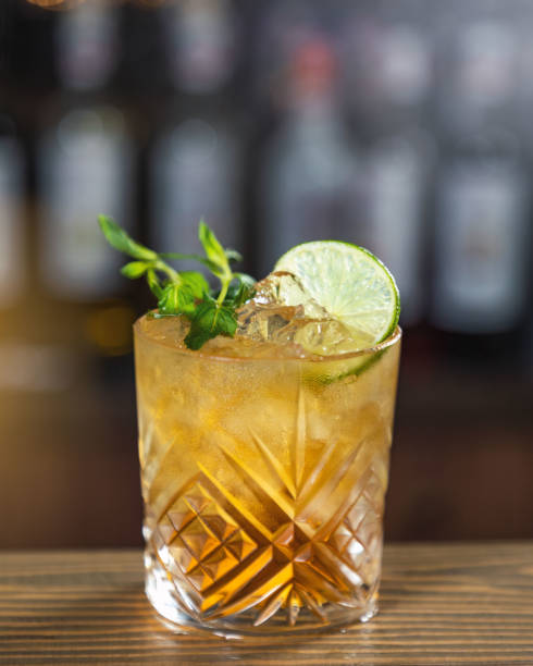 istock Whiskey cocktail standing on bar with lime and mint garnish 2167806021