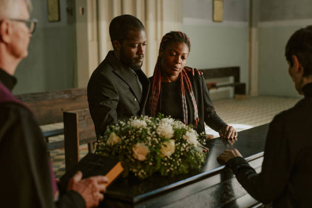 istock Family Bemoaning at Funeral 2167806286