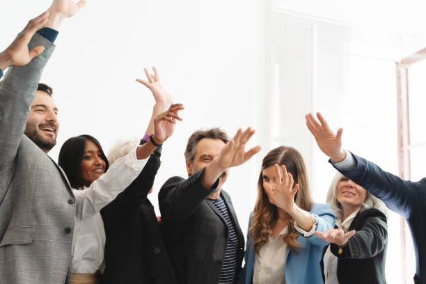 istock Diverse business team celebrating success, workplace achievement and teamwork concept 2167809486