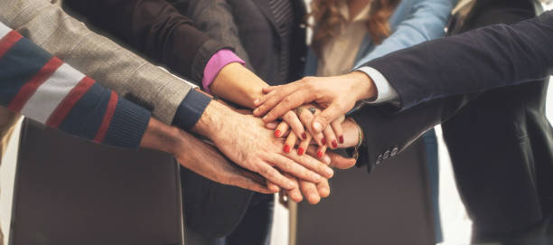 istock Business Team Hands Together in Unity - Teamwork and Collaboration Concept 2167809554