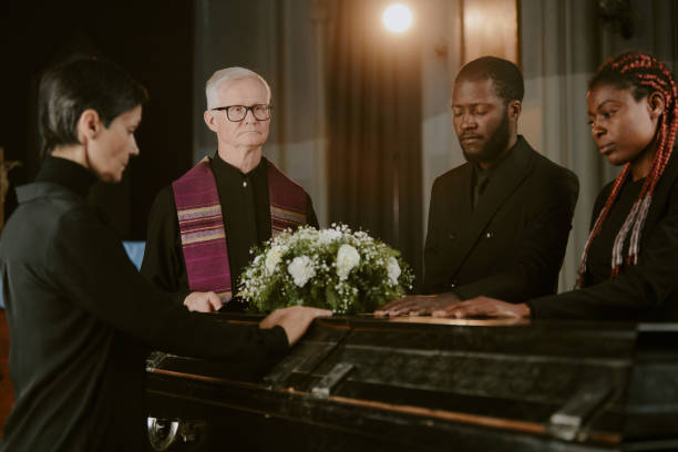 istock Black Coffin Surrounded by People 2167809746