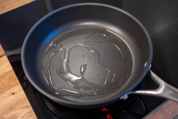 istock cooking oil on a pan 2167811164