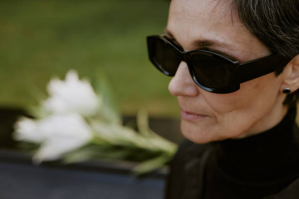 istock Senior Woman at Graveyard 2167812354