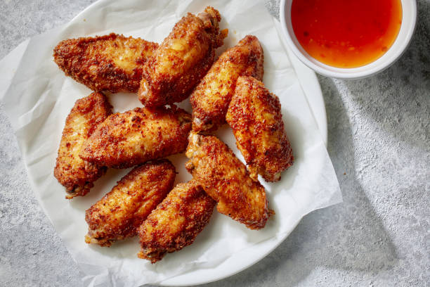 istock baked crispy chicken wings 2167812537