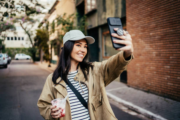 istock Young Japanese woman taking selfie 2167812851