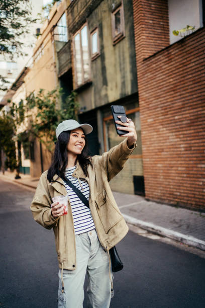 Young Japanese woman taking selfie