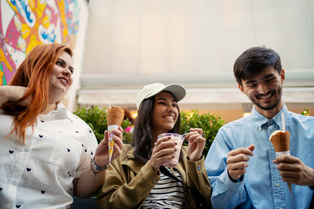 istock Young friends eating ice cream 2167812904