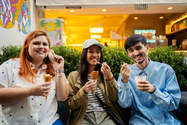 istock Young friends eating ice cream 2167812929