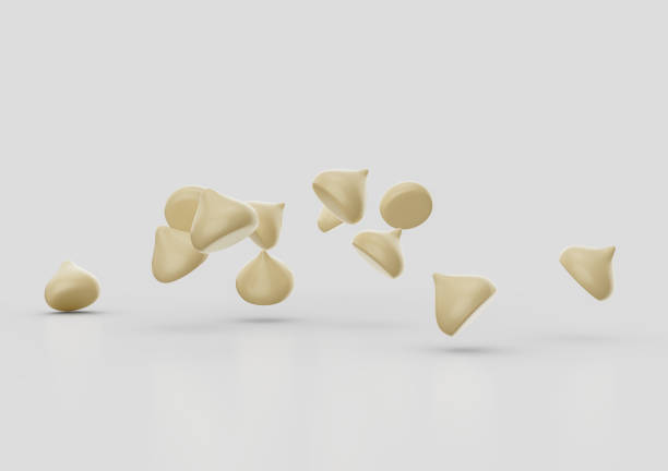 istock Creamy White Chocolate Chips Or Chocolate Morsels Scattering On White Background 3D Illustration 2167813407