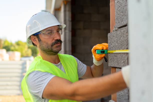 istock Civil engineer measures length on wall with meter 2167814000