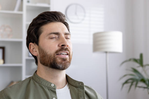 istock Young man practicing mindfulness meditation and relaxation at home 2167814977